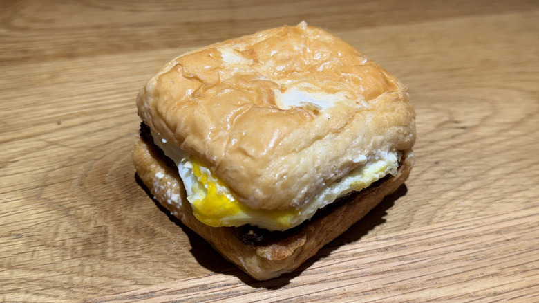 Sausage, Egg & Swiss Croissant on a table