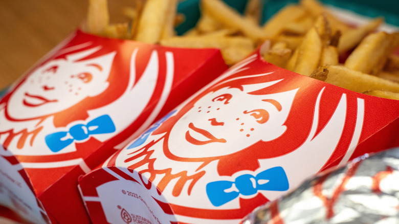 Closeup of a Wendy's box of fries on a tray.