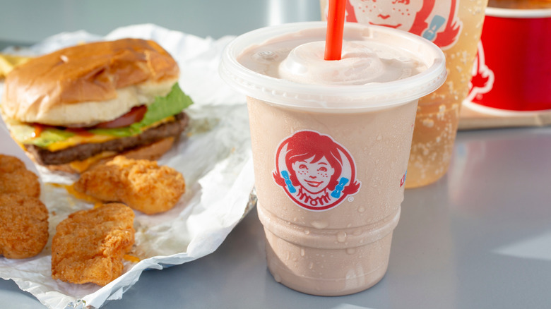Wendy's chocolate frosty next to nuggets and hamburger