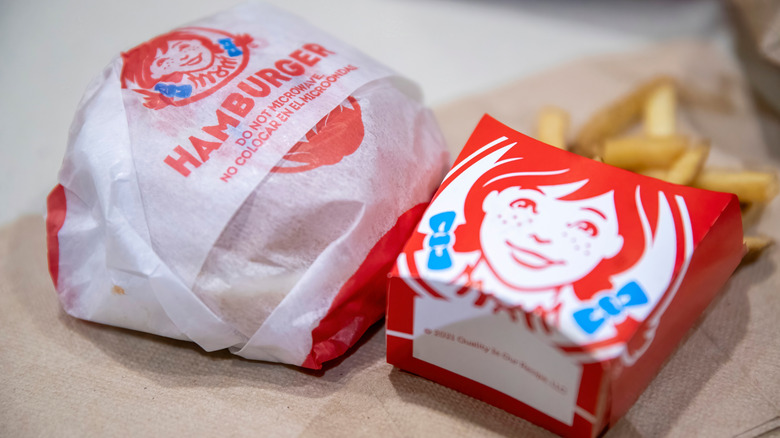 Wendy's hamburger and fries on table.