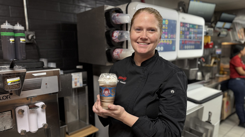 Wendy's Manager of Culinary and Innovation, Emily Kessler hold the Thin Mints Frosty Fusion