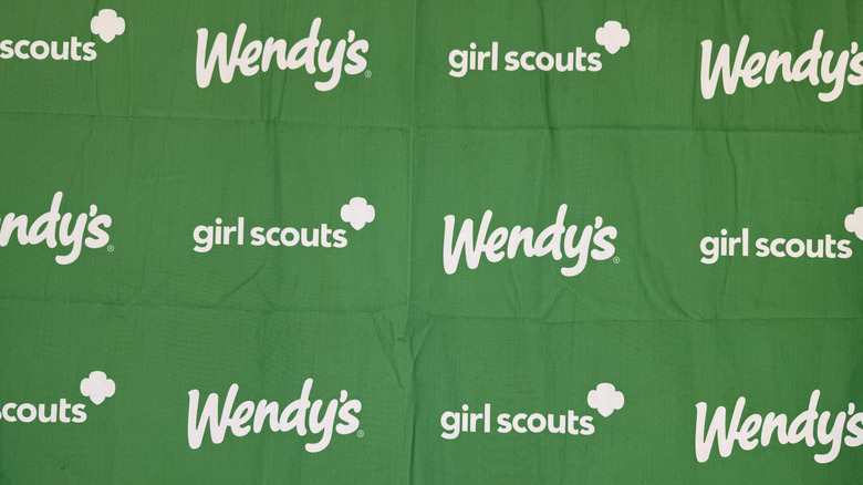 Wendy's and Girl Scouts green fabric backdrop