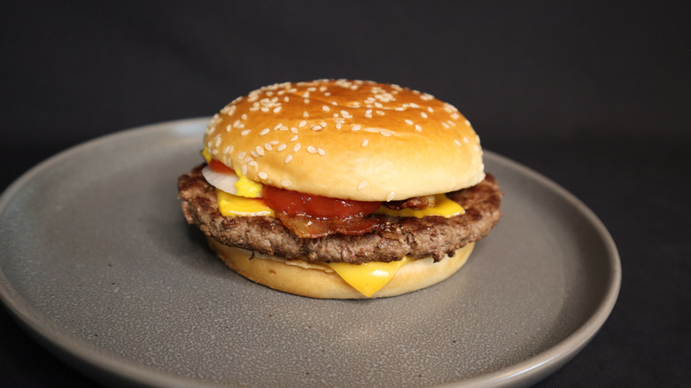 bacon Quarter Pounder with Cheese Deluxe on plate