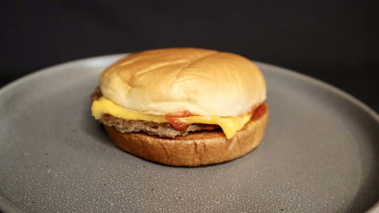 McDonald's cheeseburger on plate