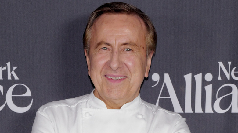Daniel Boulud in chef whites on event red carpet