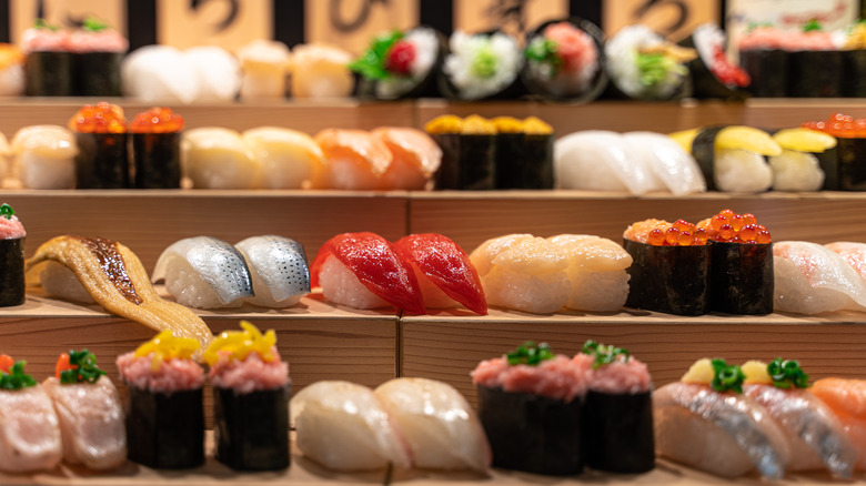 Sushi displayed on a stand.