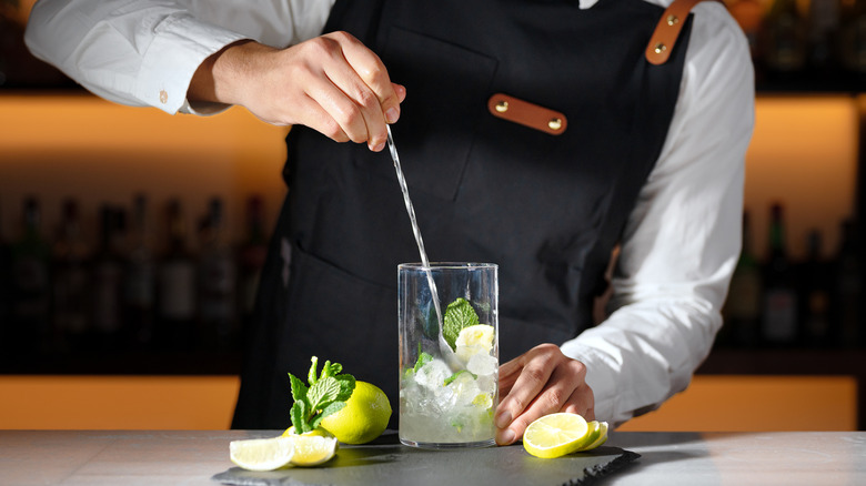 Bartender making a mojito