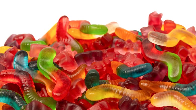 An assortment of gummy worms and gummy bears.