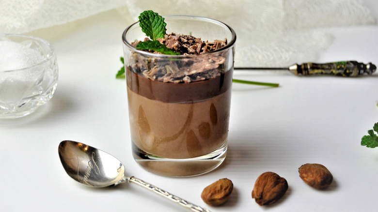 A chocolate mousse dessert in a glass cup