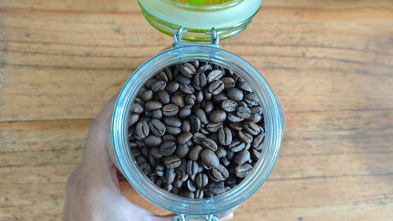 An open jar of coffee beans