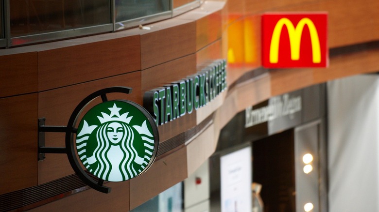 Starbucks sign next to McDonald's sign