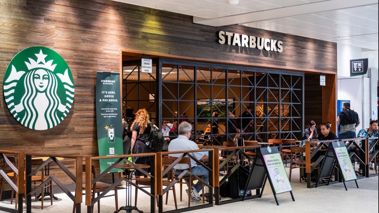 Customers at Starbucks inside airport