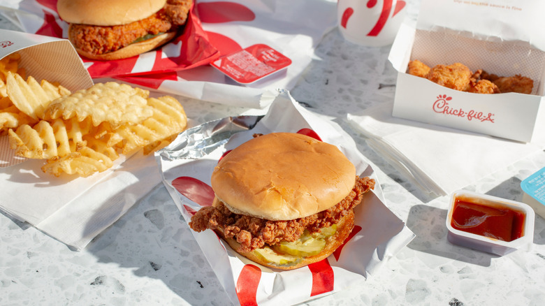 A spread of Chick-fil-A food on a white table.