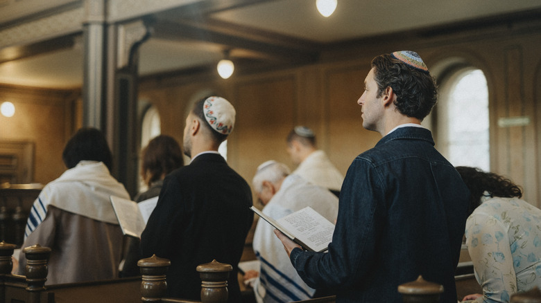 Members of the Jewish faith gathered in a synagogue