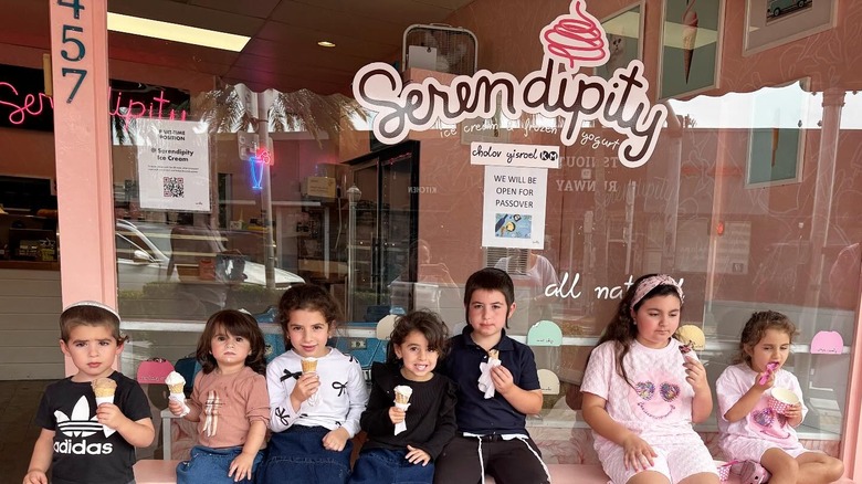Children eating ice cream in front of Serendipity Creamery in Surfside, Florida.