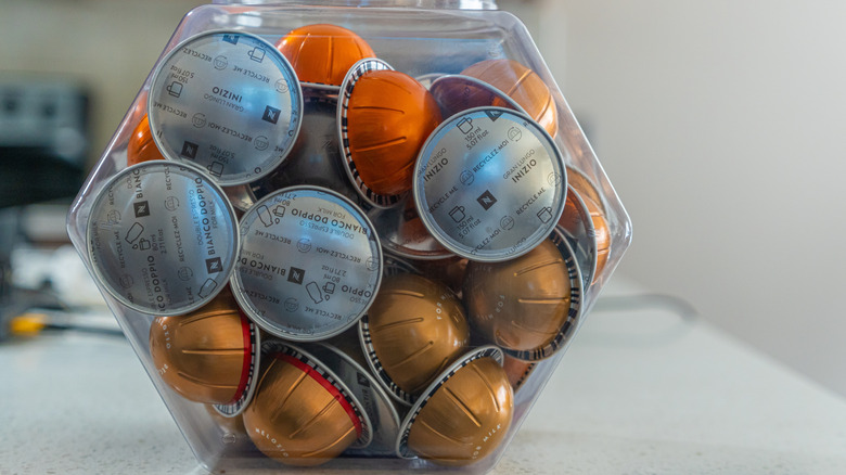 A container filled with Nespresso pods