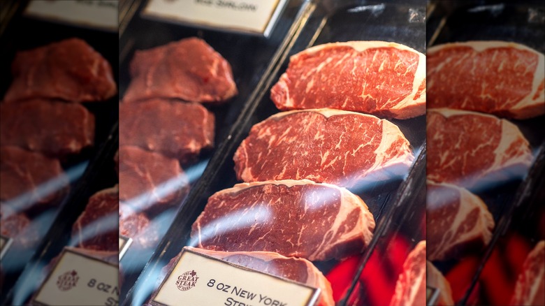 Texas Roadhouse strip steaks on display in the restaurant