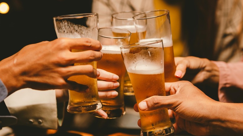People toasting with beer