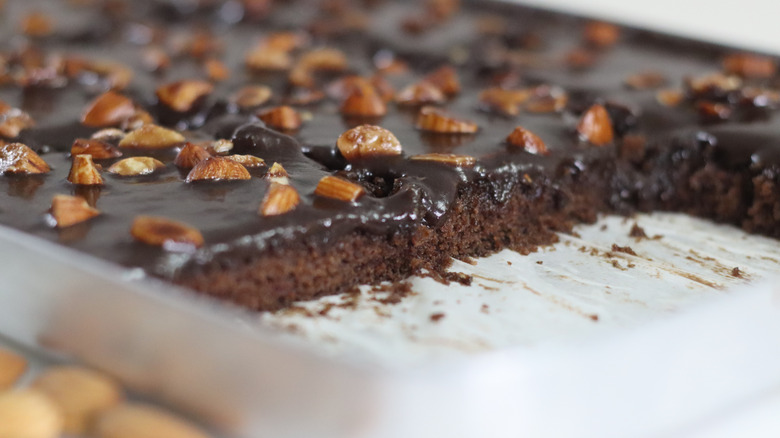 Thin Texas sheet cake with fudge icing and nuts