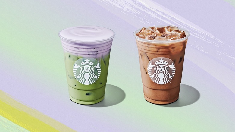 Starbucks oatmilk lavender matcha and lavender oatmilk latte sitting on a surface.