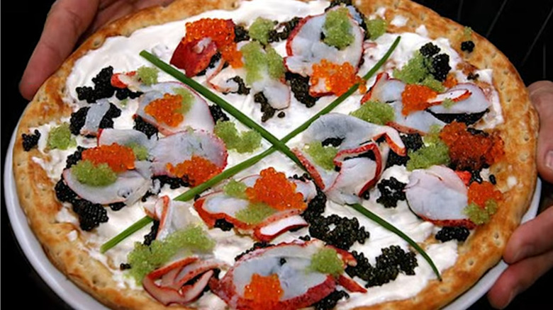 A gourmet pizza shown in a Youtube documentary about Louis XIII pizza, topped with caviar and other extravagant ingredients