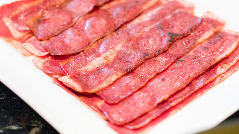 A plate of cooked turkey bacon