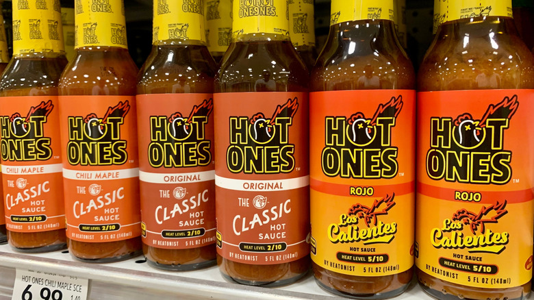 Hot Ones hot sauces on a supermarket shelf