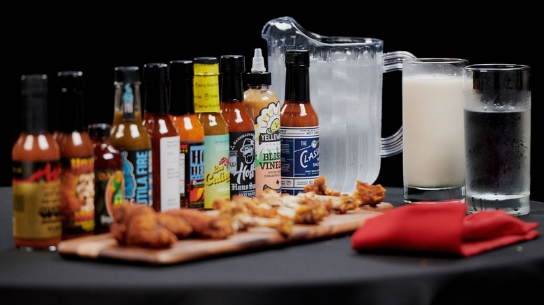 Multiple Hot Ones hot sauces on a table