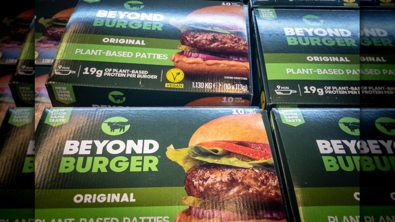 packages of Beyond brand original plant-based burger patties displayed in a grocery store