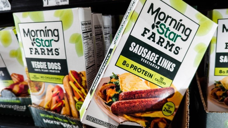 MorningStar Farms veggie dogs and plant-based sausage links on a grocery store shelf