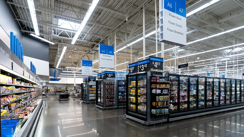 The interior of a modern-day Walmart store featuring food products