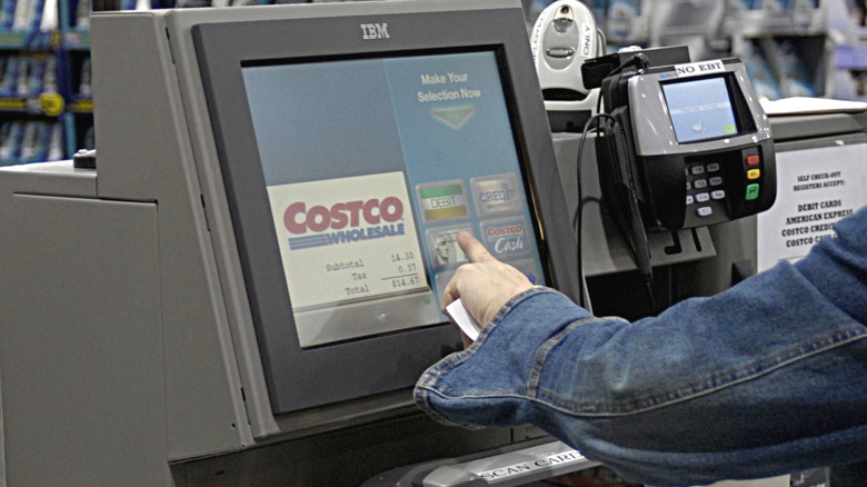 Person paying at Costco register