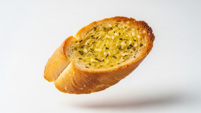 Garlic bread slice isolated on a white background