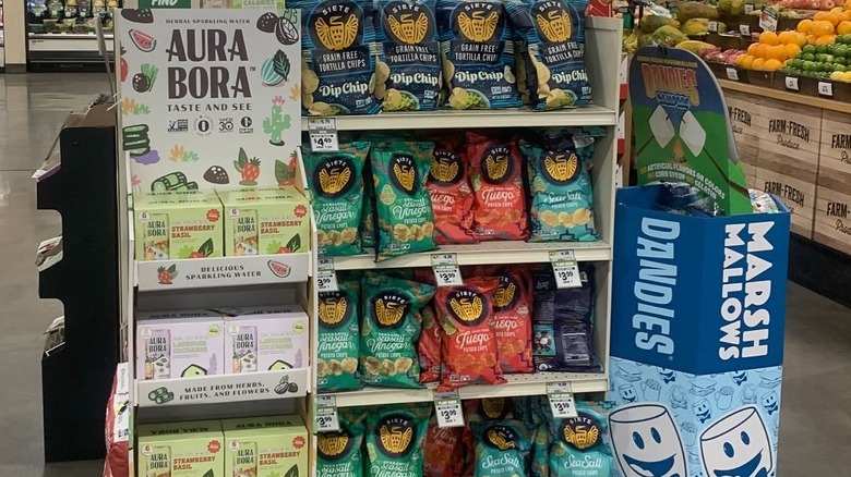 Cases of Aura Bora sparkling water in a Whole Foods store