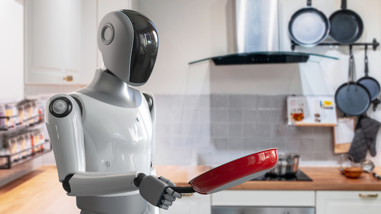 A robot chef with red pan in hand