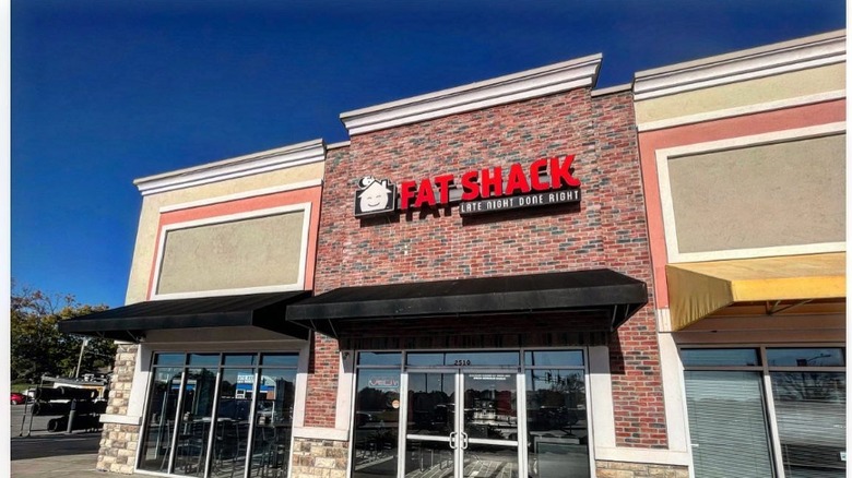 A front view of a Fat Shack restaurant in Kansas City, MO