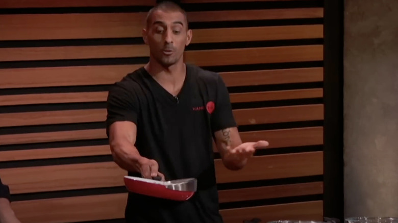 Adam Chaudry demonstrating how to use Handy Pan in front of the sharks.