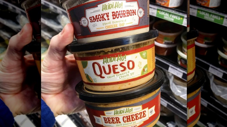 Hand holding Heidi Ho cheese products