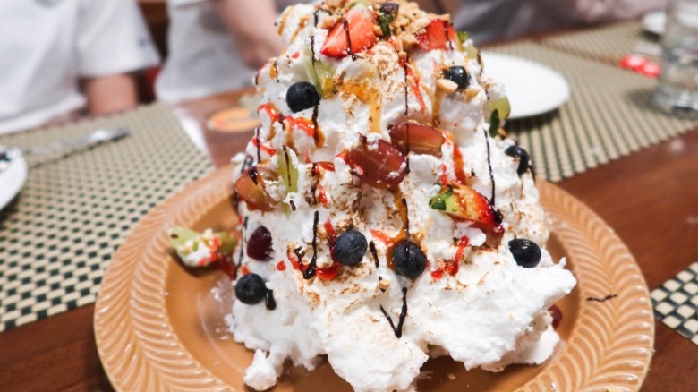 A large Baked Alaska on a table.