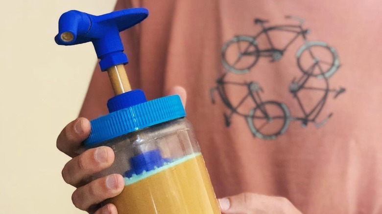 Person holding the Peanut Butter Pump