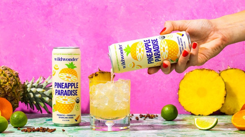 The pineapple paradise flavored drink being poured into a glass