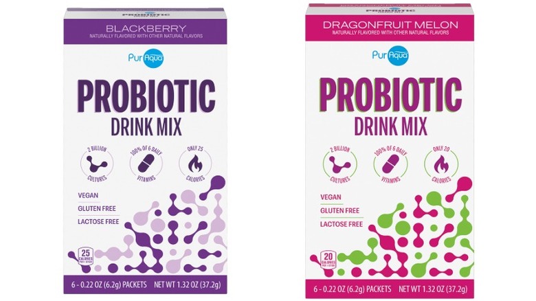 Packages of PurAqua Probiotic Drink Mix Sticks in Blackberry and Dragonfruit Melon on a white background.