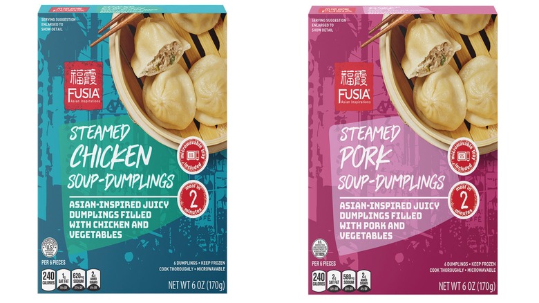 The Blue Fusia Asian Inspirations Steamed Chicken Soup Dumplings box next to the pink Fusia Asian Inspirations Steamed Pork Soup Dumplings box