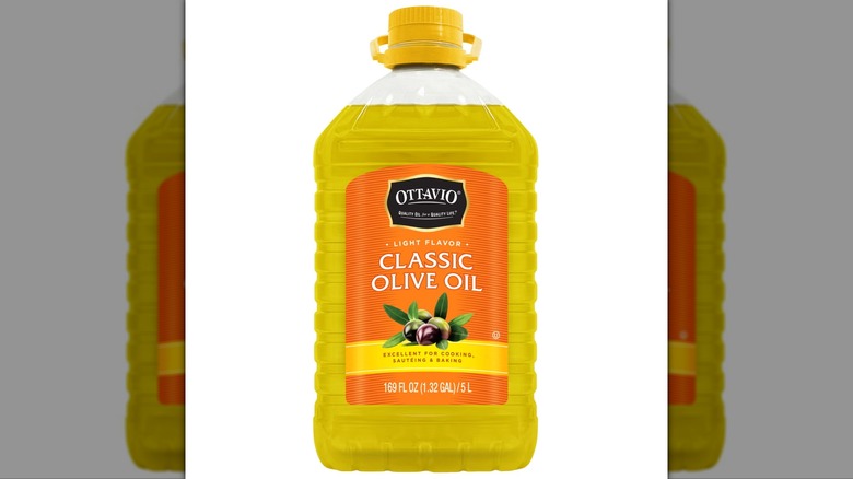 Bottle of Ottavio Classic Olive Oil with yellow lid against white background