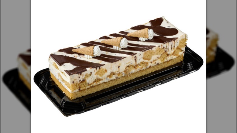 The Kirkland Signature Waffle Cone Bar Cake from Costco on a black cake tray on a white background.