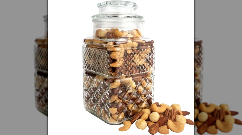 A.L. Schutzman Premium Blend Jar with scattered nuts on white background