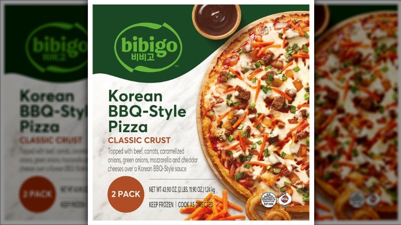 Bibigo Korean BBQ-Style Pizza in cardboard packaging on a white background.