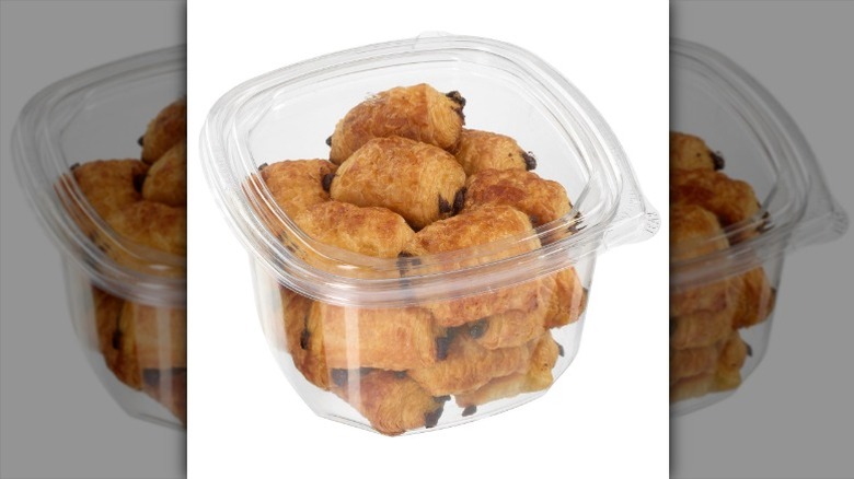 Kirkland Signature Mini Pains Au Chocolat in a clear plastic tub on a white background.