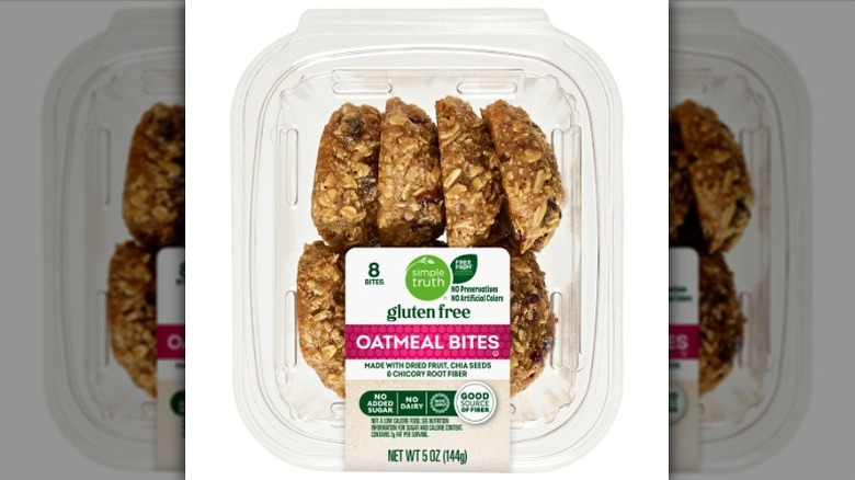 A clear plastic clamshell package of Simple Truth Gluten Free Oatmeal Bites on a white background.