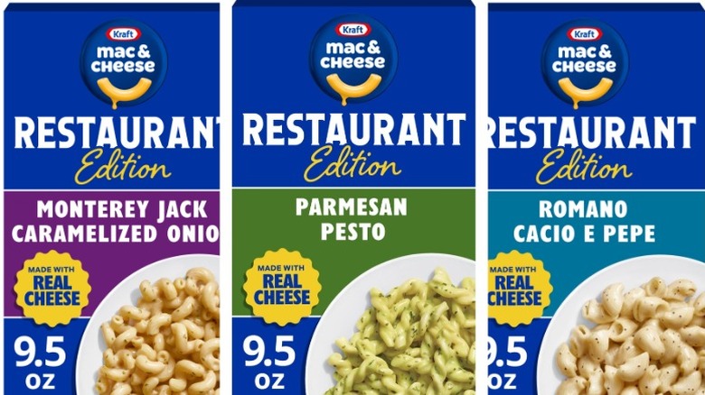 Boxes of Kraft Mac & Cheese Restaurant Edition in Monterey Jack Caramelized Onion, Parmesan Pesto, and Romano Cacio e Pepe on a white background.
